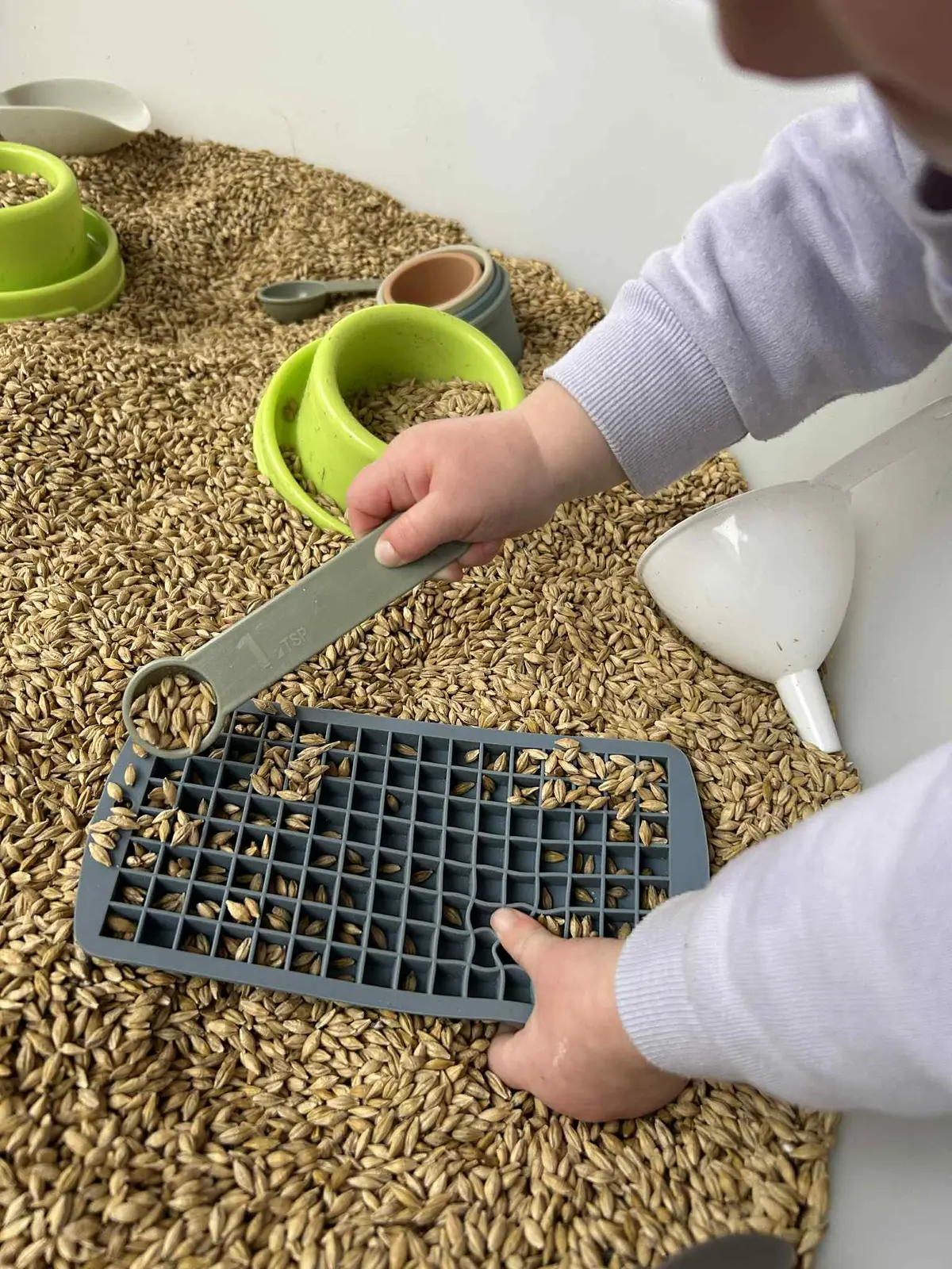 Overhead messy-play and natural materials in the PlayTray